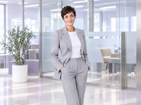 Pair a tie-free blazer with a relaxed professional look
